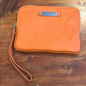 Orange leather cole haan zippered clutch